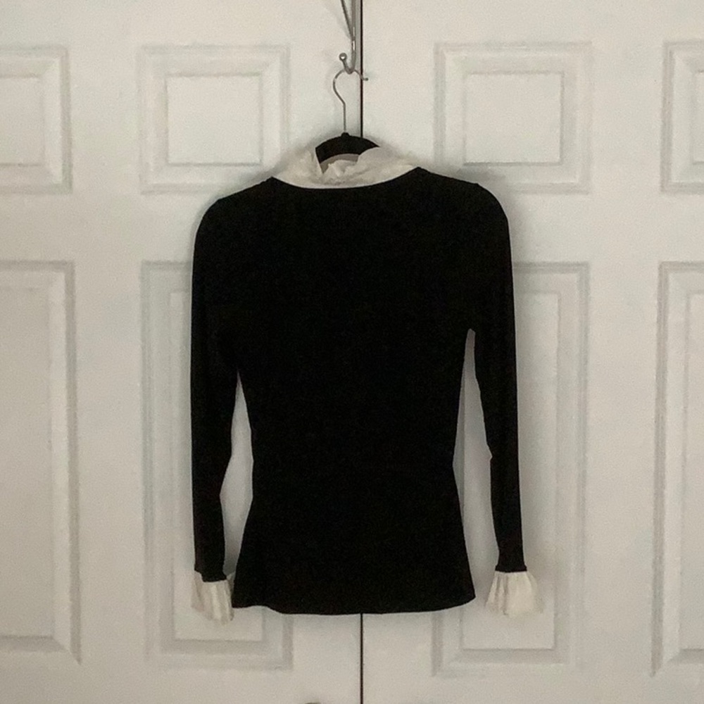 White House black market black top with white ruffled neck and sleeves. - Picture 4 of 6